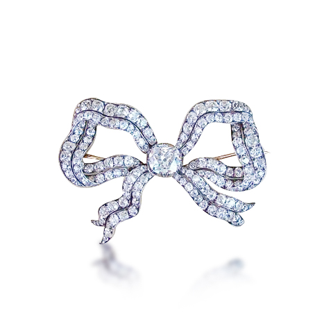 An antique bow brooch set with Old Mine Cut diamonds, circa 1890, previously sold at Revival Jewels