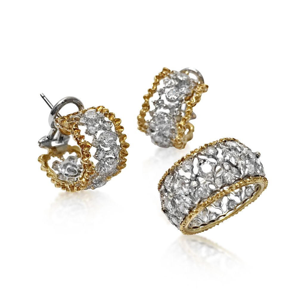 Now available at Revival Jewels: a set of 18k gold and diamond ring and earrings. Of openwork and lacey-edge design, the ring is set with 36 circular-cut diamonds, and the half-hoop earrings set with 32 circular-cut diamonds each, mounted in 18K white and yellow gold, ring size is 4 1/8, while the earrings measure 1.5cm in length. Signed Buccellati, Italy. Total diamond weight approx. 1.0-2.0 carats.