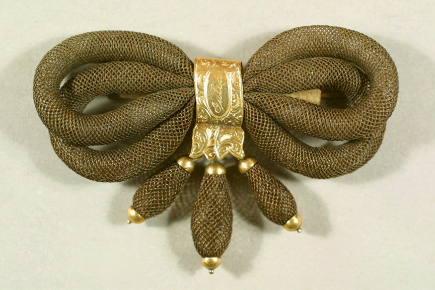 A brooch made with hair, circa 1864.