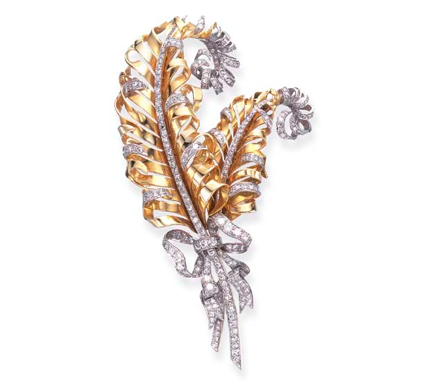 A Retro Diamond and Gold Feather Brooch, by Fulco Di Verdura for Paul Flato. Designed as twin sculpted gold plumes, enhanced by single-cut diamond trim, tied with an old European and single-cut diamond ribbon, mounted in platinum and gold, circa 1935. One of the pieces offered in the Doris Duke Collection of Important Jewellery at Christie's, 2nd June 2004 for an estimate of $8000 - $10000. Price realised $23,900.