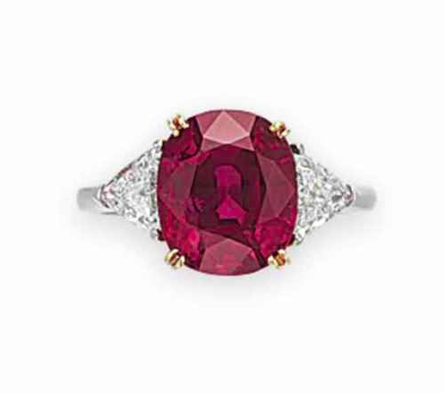 A Ruby and Diamond Ring (Price realised 245,000 USD) - Sold by Christie's 10th December 2015, New York ( Source: www.christies.com) Set with an oval-cut ruby, weighing approximately 4.76 carats, flanked on either side by a triangular-shaped diamond, ring size 5 1/2, mounted in platinum. Accompanied by report no. CS 71242 dated 29 October 2015 from the AGL American Gemological Laboratories stating that it is the opinion of the Laboratory that the origin of the ruby, weighing 4.76 carats, is Burma (Myanmar), with no heat enhancement.