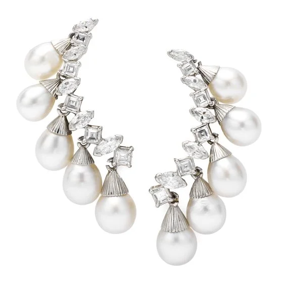    A Pair of Diamond and Pearl Ear Clips, by Sterlé   