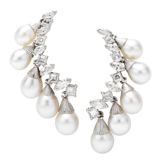    A Pair of Diamond and Pearl Ear Clips, by Sterlé   