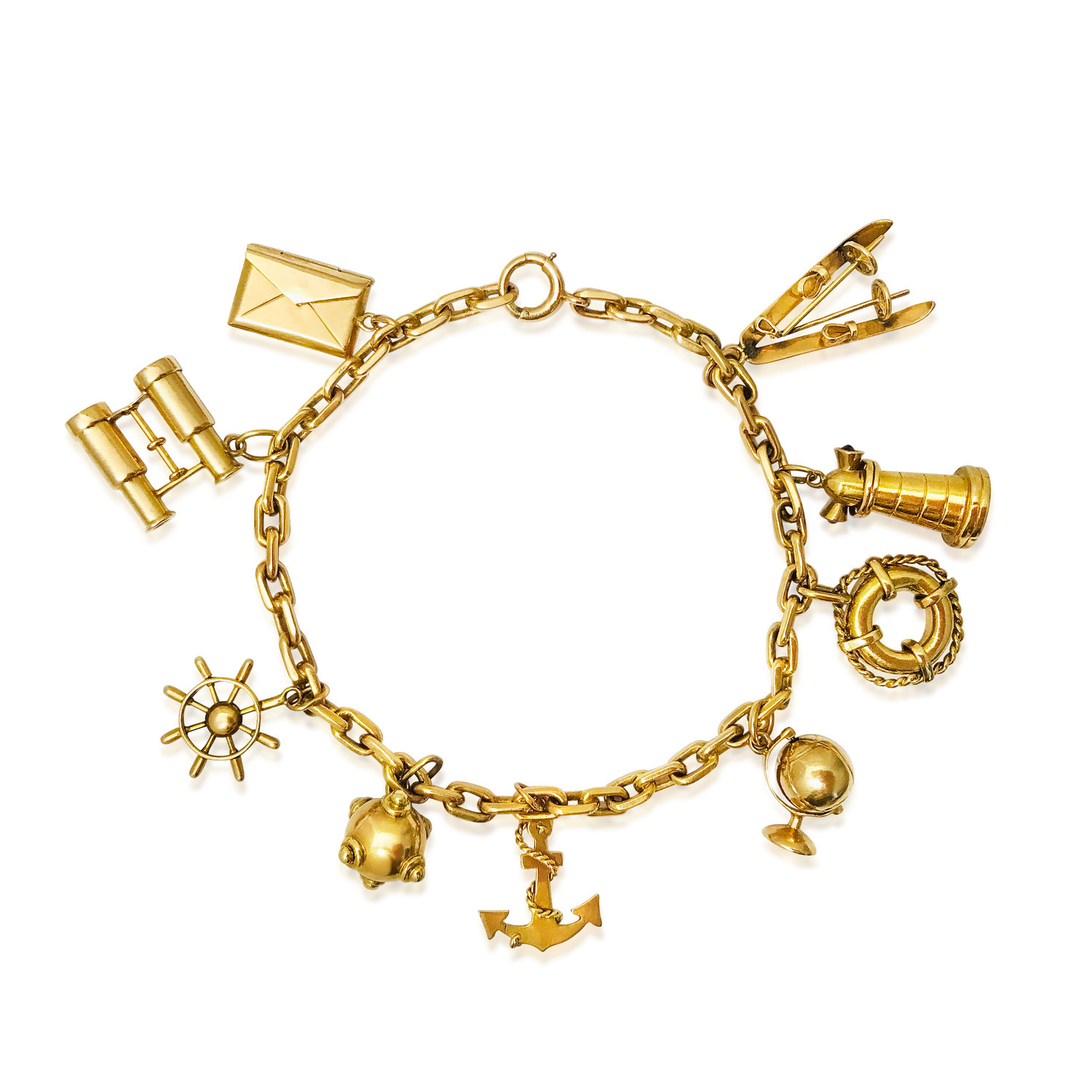 A GOLD "TRAVELLING THEME" CHARM GOLD BRACELET - SOLD