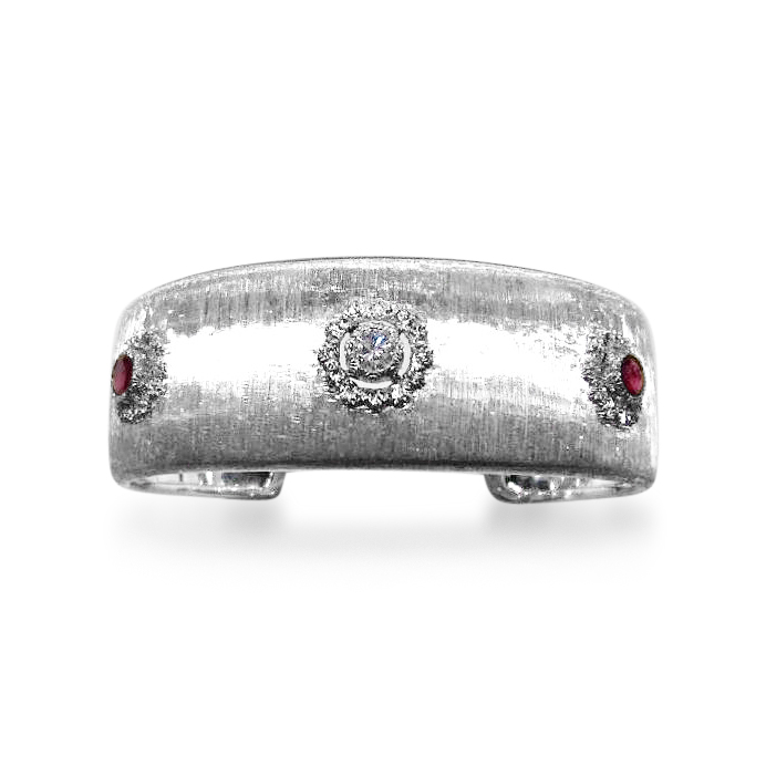 AN RUBY AND DIAMOND BANGLE IN 18K WHITE GOLD, BY BUCCELLATI  