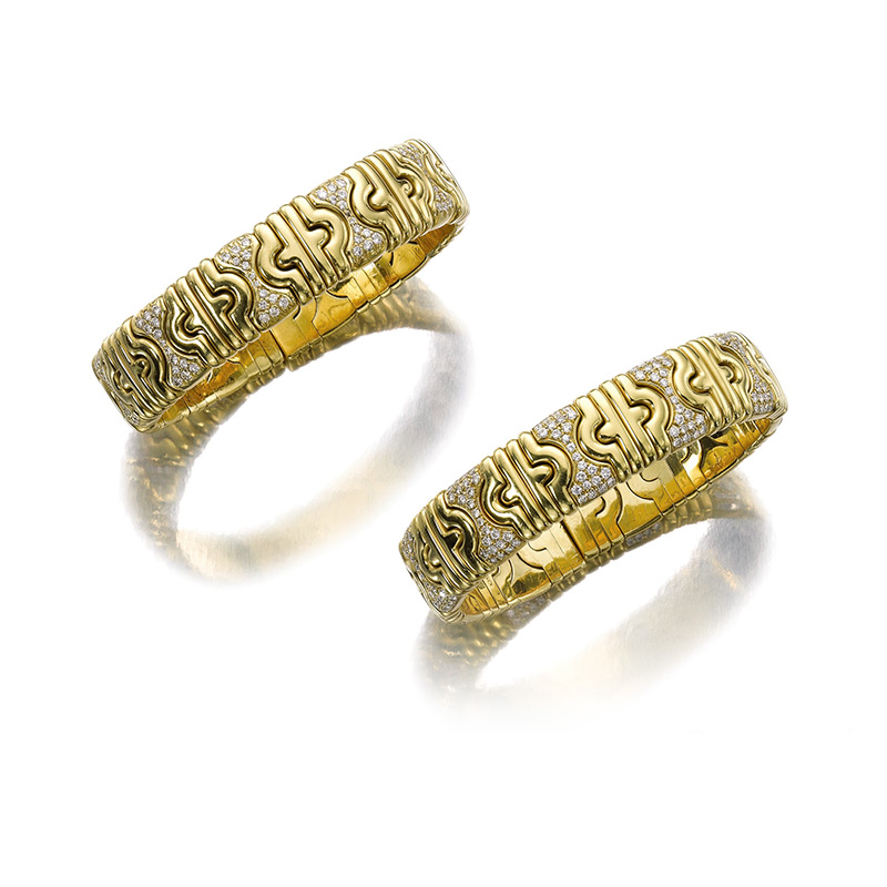 A PAIR OF "PARENTHESIS" GOLD AND DIAMOND BANGLE BRACELETS, BY BULGARI  