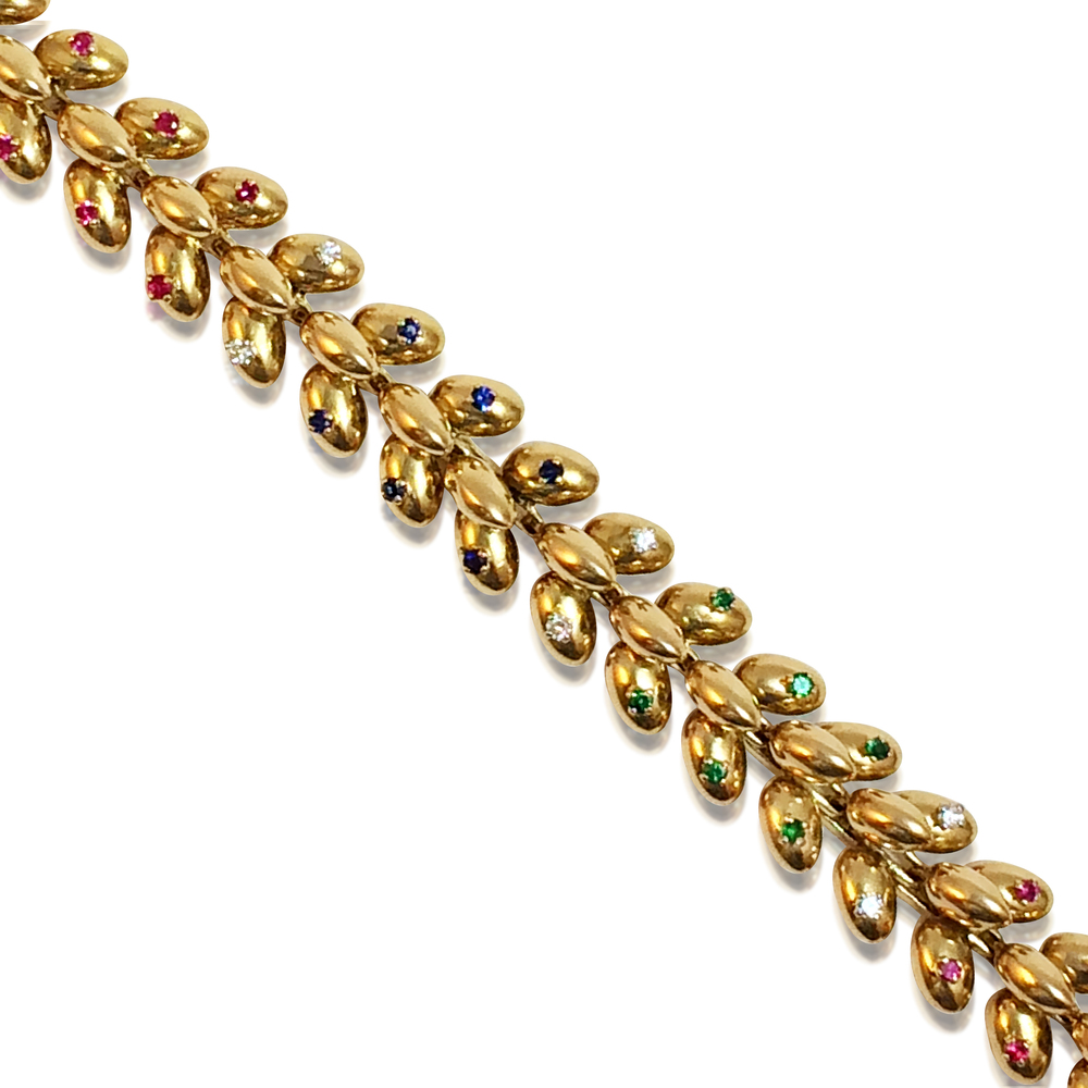 AN 18K GOLD BRACELET SET WITH DIAMOND, RUBY AND SAPPHIRE, BY BOUCHERON - SOLD