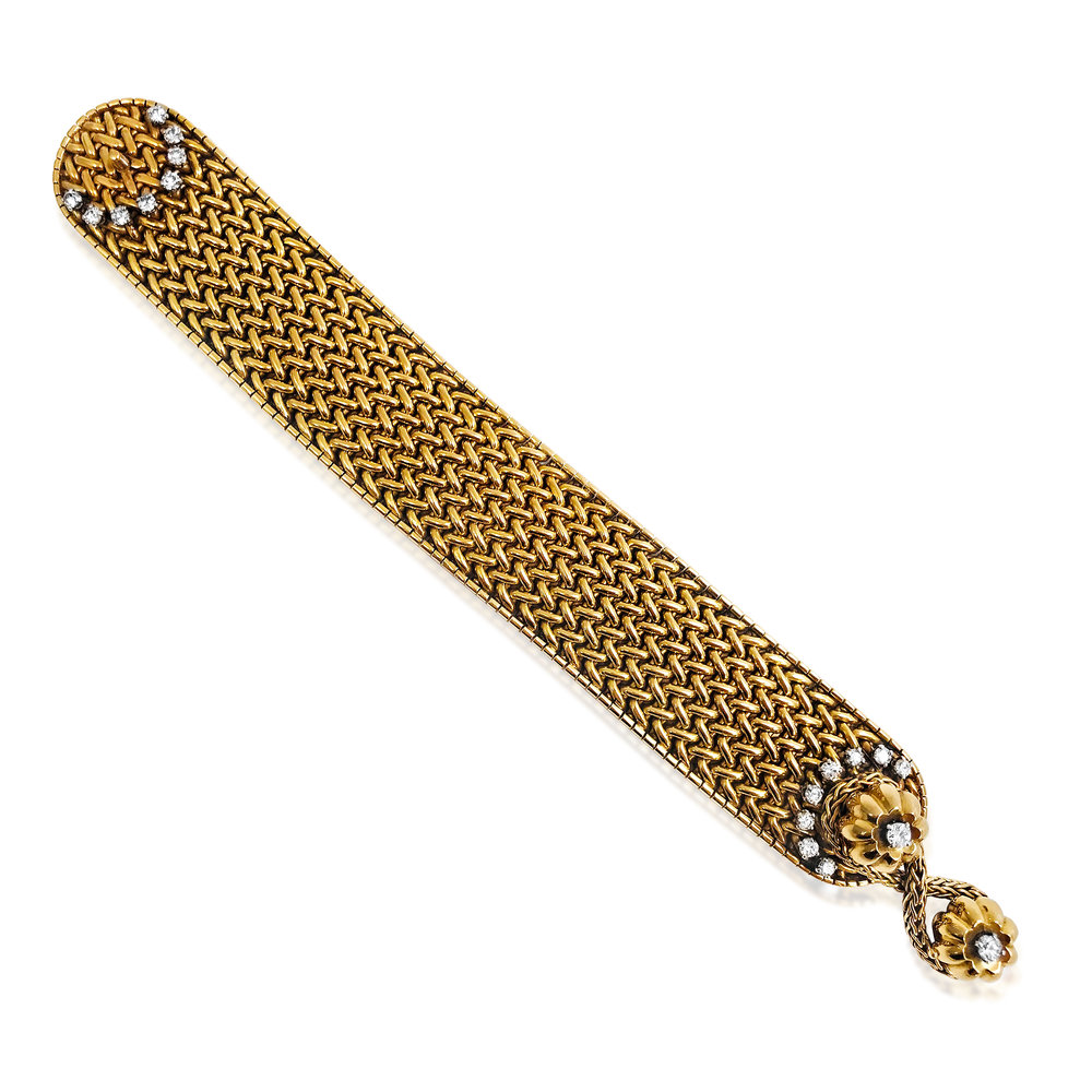 A YELLOW GOLD AND DIAMOND BRACELET - SOLD