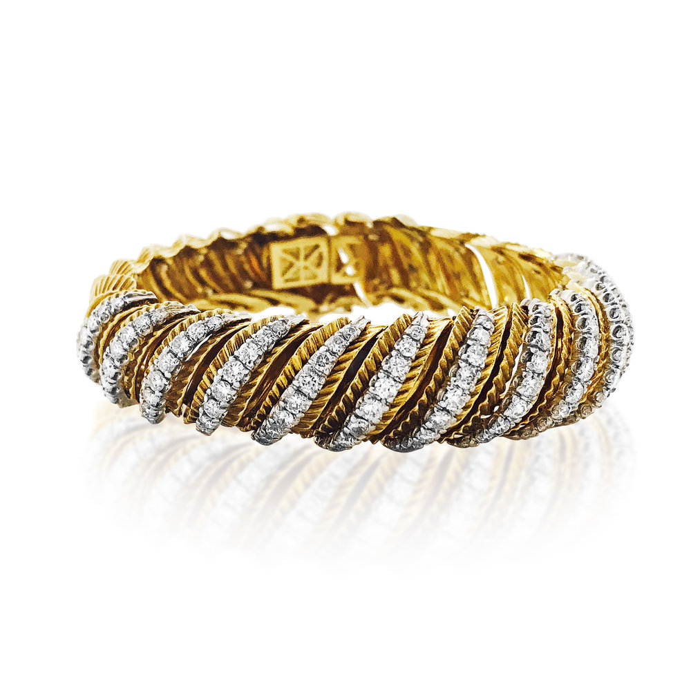 A DIAMOND AND YELLOW GOLD WATCH BRACELET - SOLD