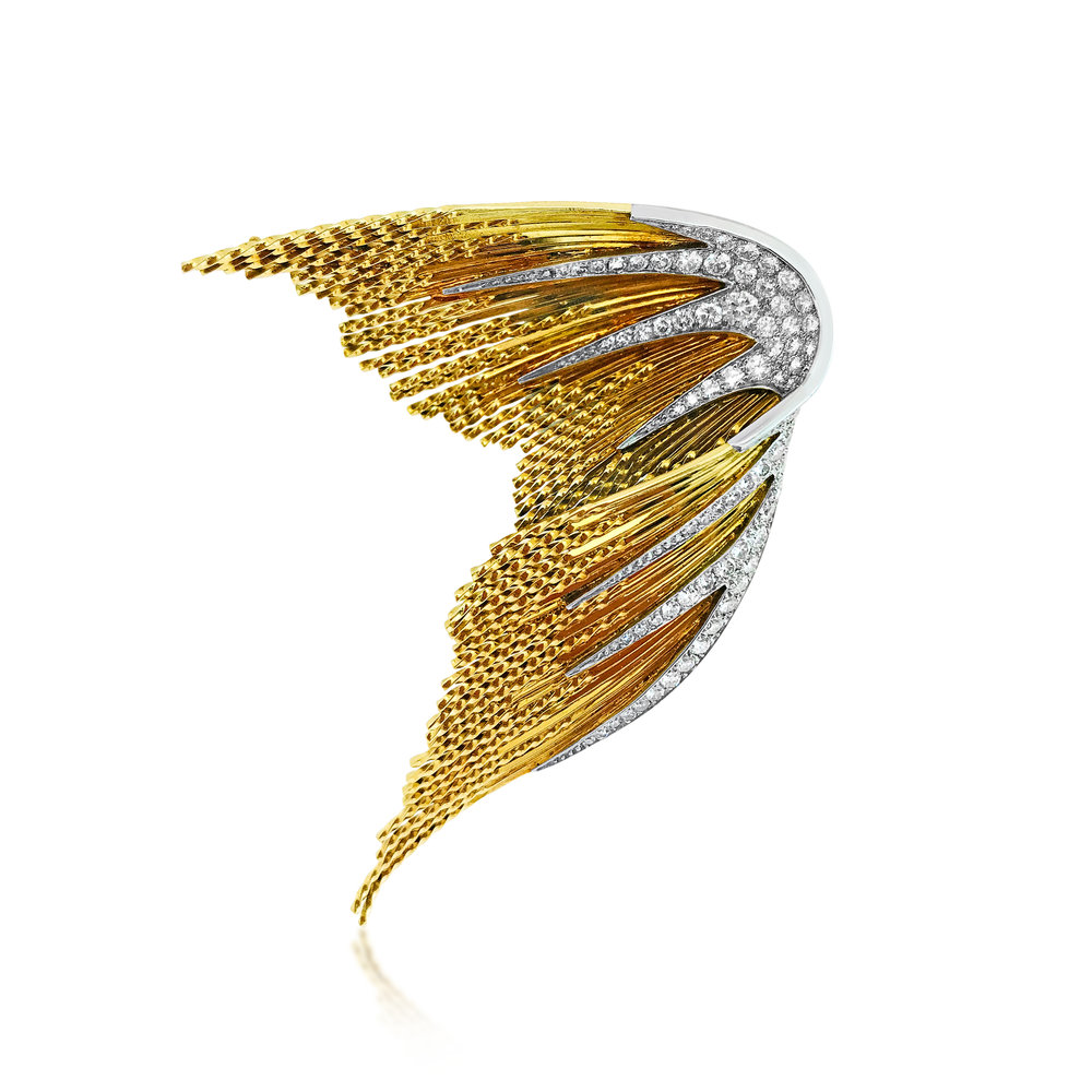 A GOLD AND DIAMOND BROOCH, BY STERLE  
