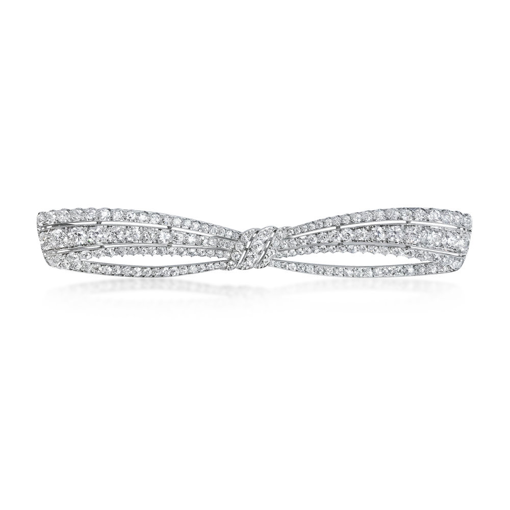 AN ART DECO PLATINUM AND DIAMOND BROOCH, BY DREICER &amp; CO. - SOLD