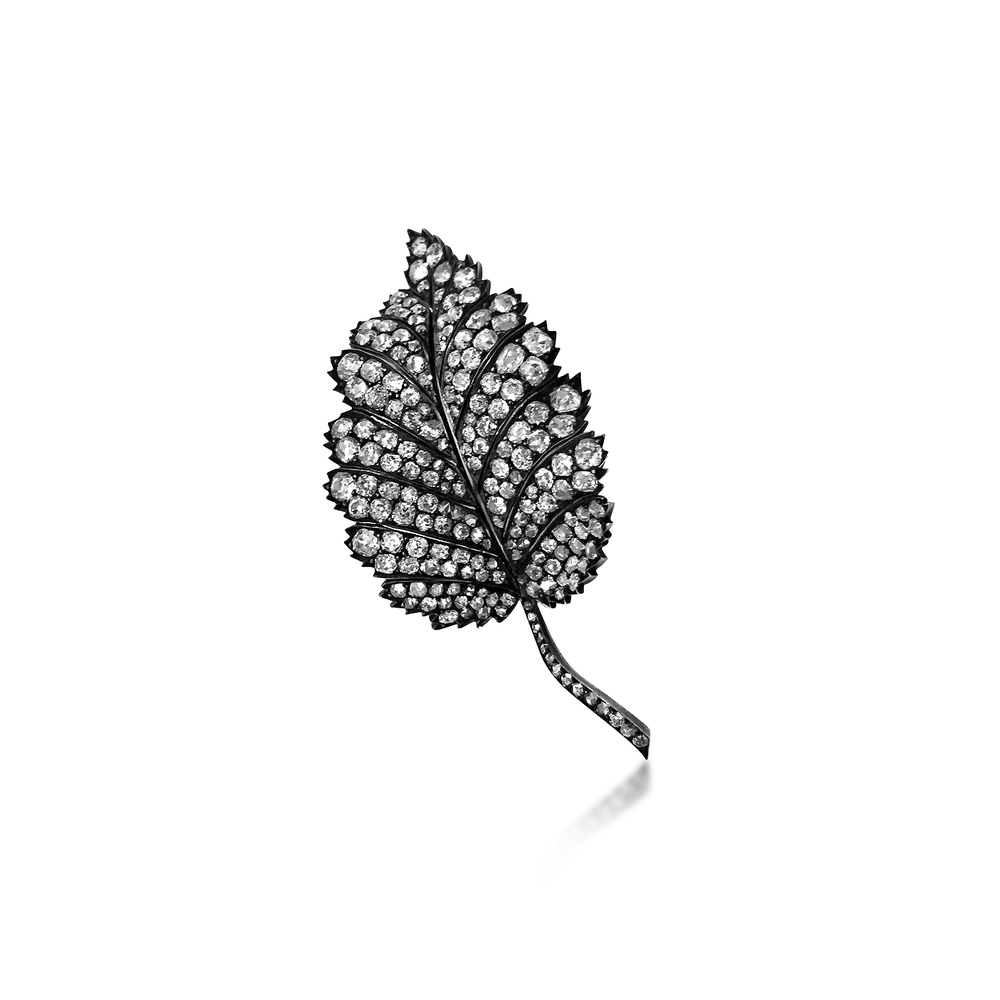 A LEAF-SHAPED DIAMOND BROOCH - SOLD