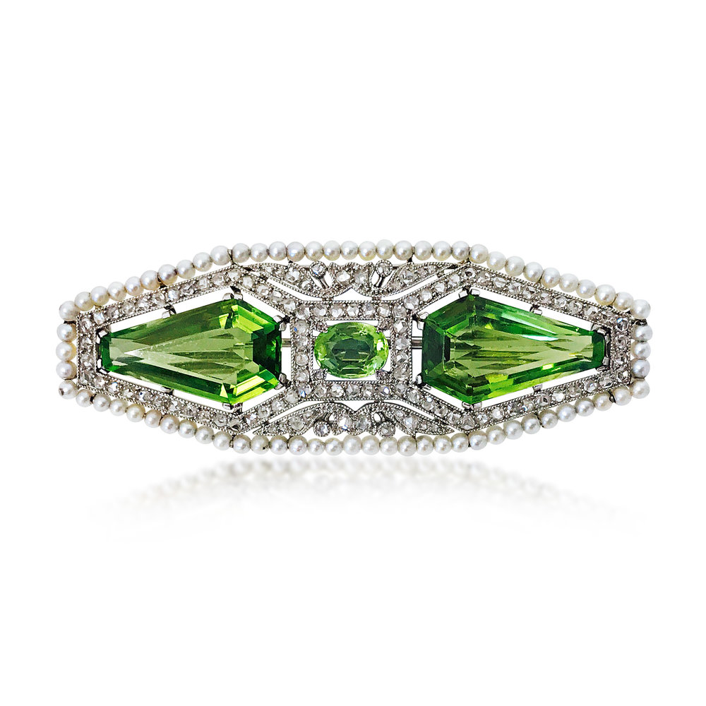 A BELLE EPOQUE PERIDOT AND SEED PEARL BROOCH, CIRCA 1910 - SOLD