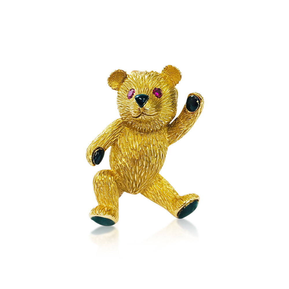 A YELLOW GOLD, RUBY AND ENAMEL BEAR BROOCH, BY CARTIER - SOLD