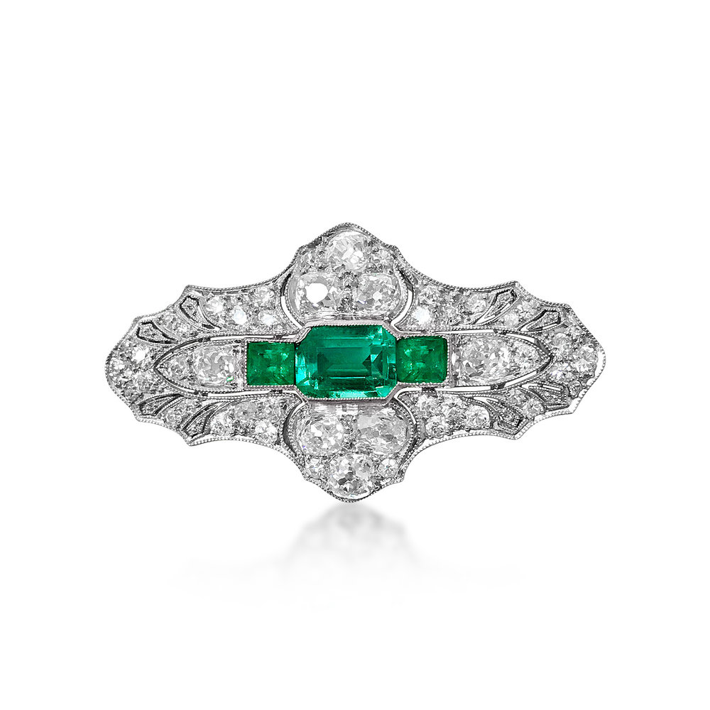 AN EMERALD AND DIAMOND BROOCH/PENDANT, BY MARCUS &amp; CO. - SOLD