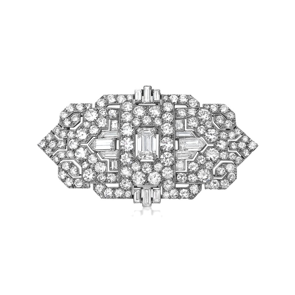 AN ART DECO PLATINUM AND DIAMOND BROOCH/PENDANT - SOLD