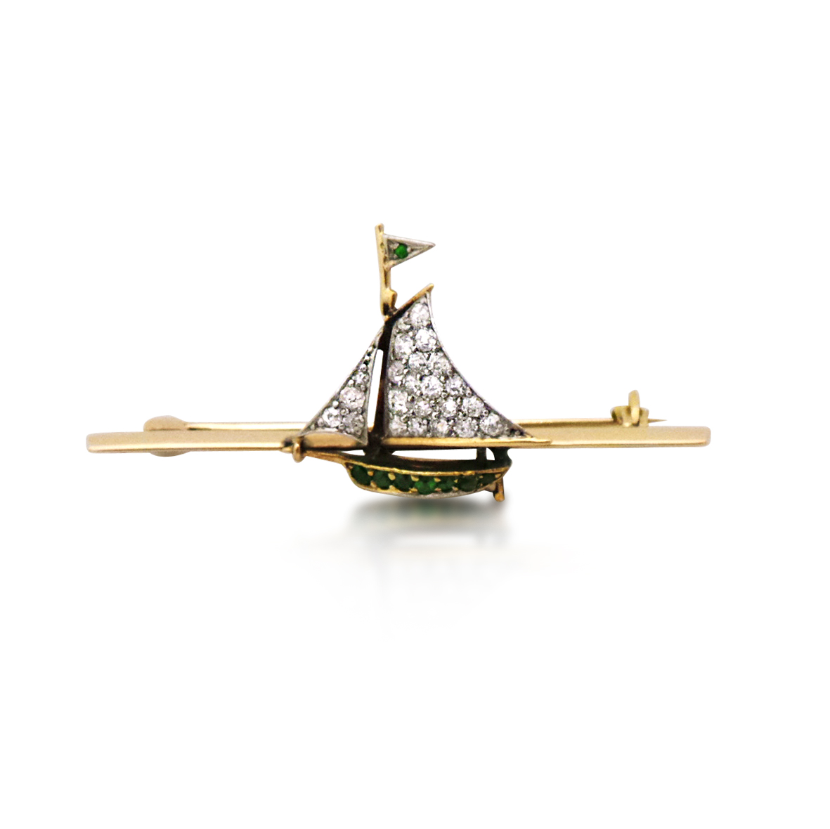 AN EDWARDIAN DIAMOND AND GARNET SAILBOAT BROOCH, CIRCA 1910 - SOLD