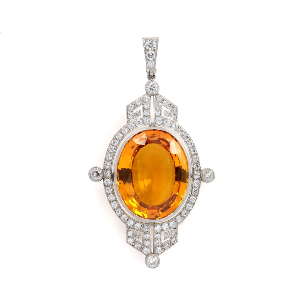 AN ART DECO TOPAZ AND DIAMOND PENDANT 