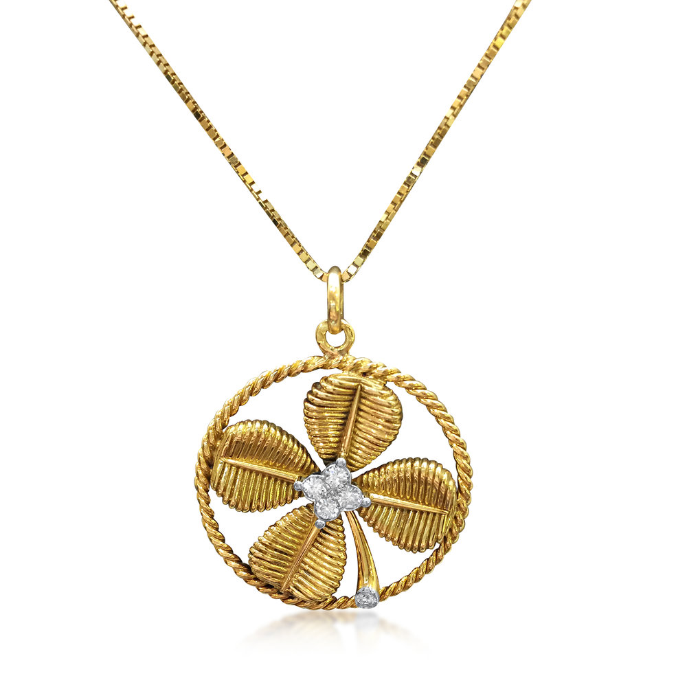 AN 18K YELLOW GOLD AND DIAMOND FOUR LEAF CLOVER CHARM, SIGNED VAN CLEEF &amp; ARPELS  