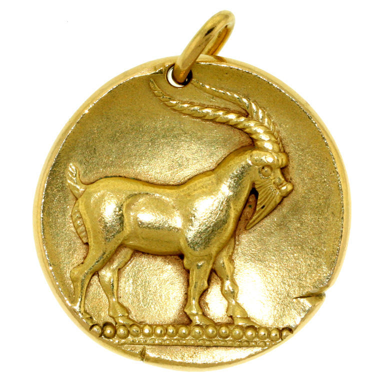 AN 18K GOLD CAPRICORN PENDANT, BY VAN CLEEF &amp; ARPELS  