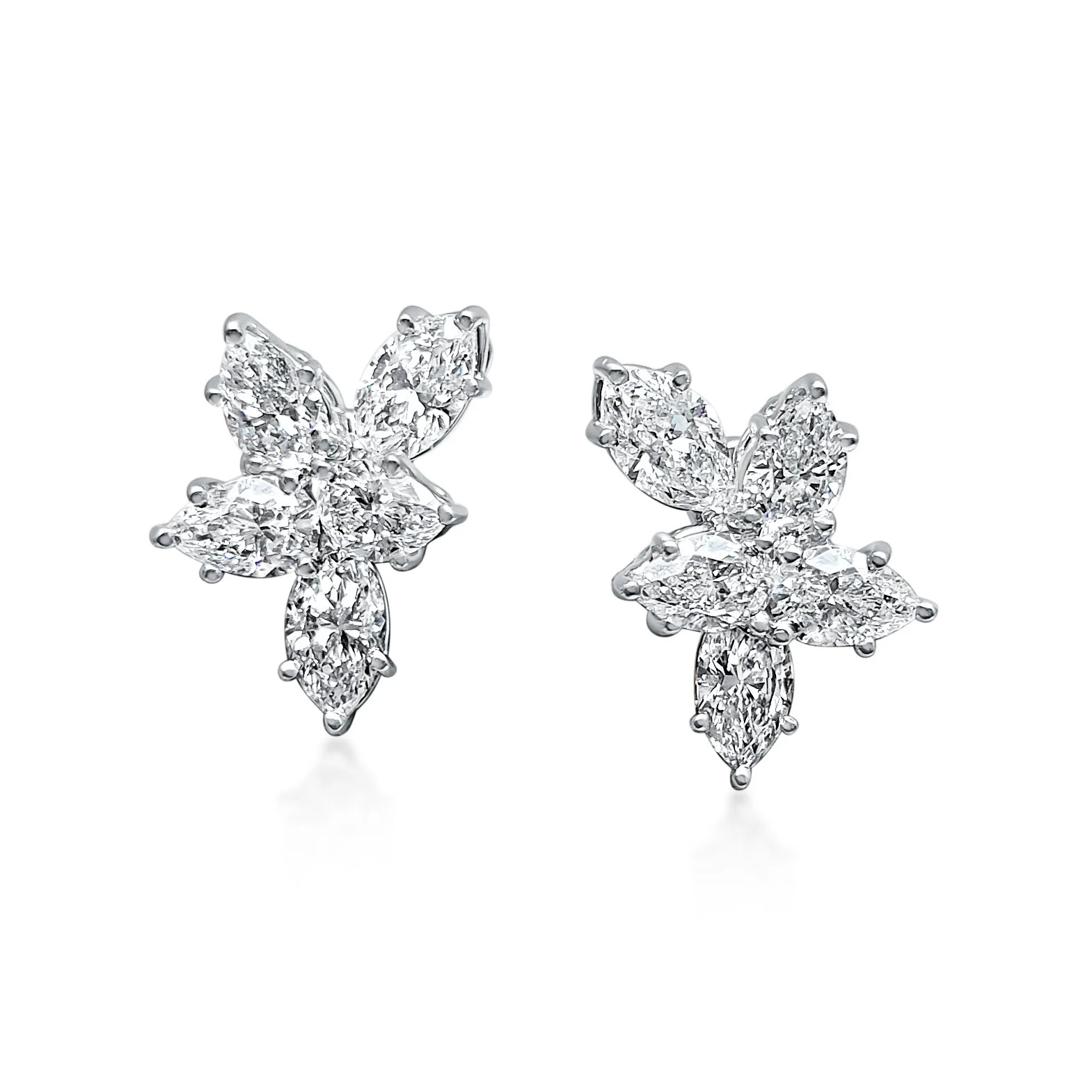 A Pair of Diamond Cluster Earrings, by Harry Winston