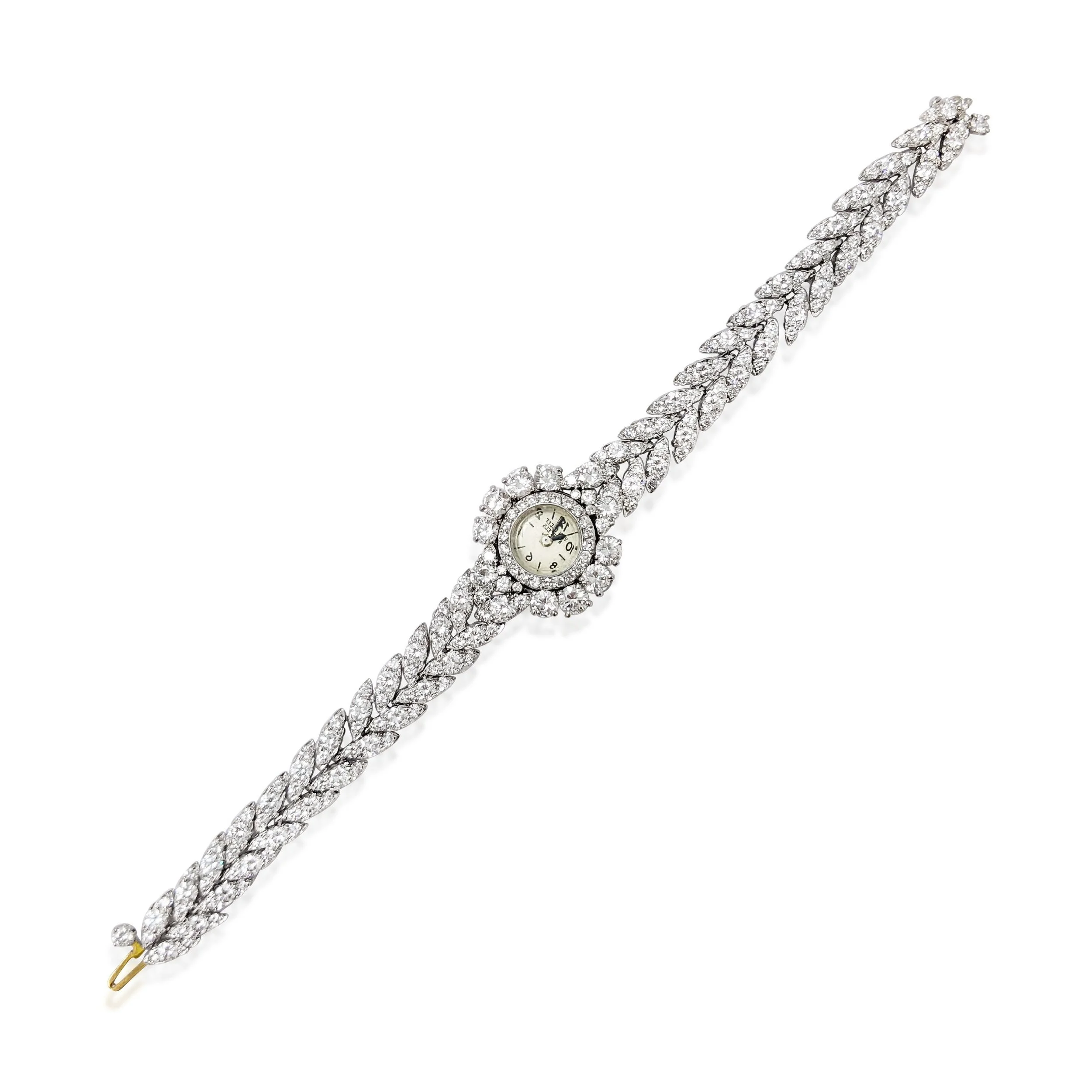 A Diamond and Platinum Watch Bracelet, by Van Cleef and Arpels