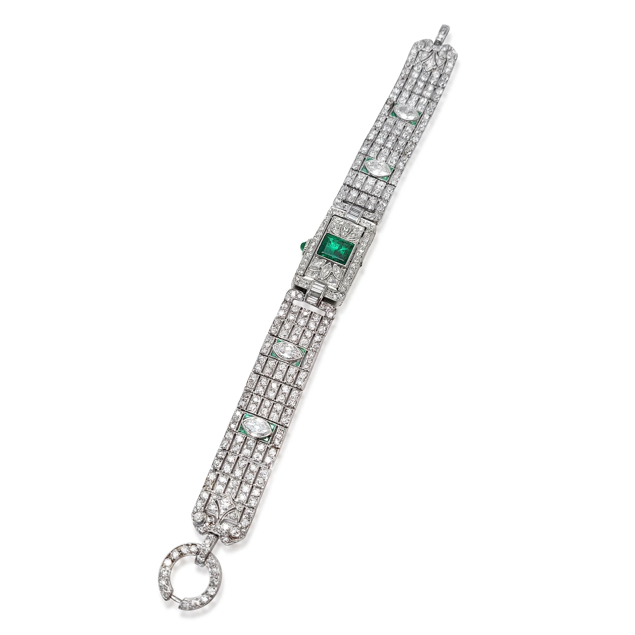 An Art Deco Diamond and Emerald Watch Bracelet by Gattle, circa 1920.