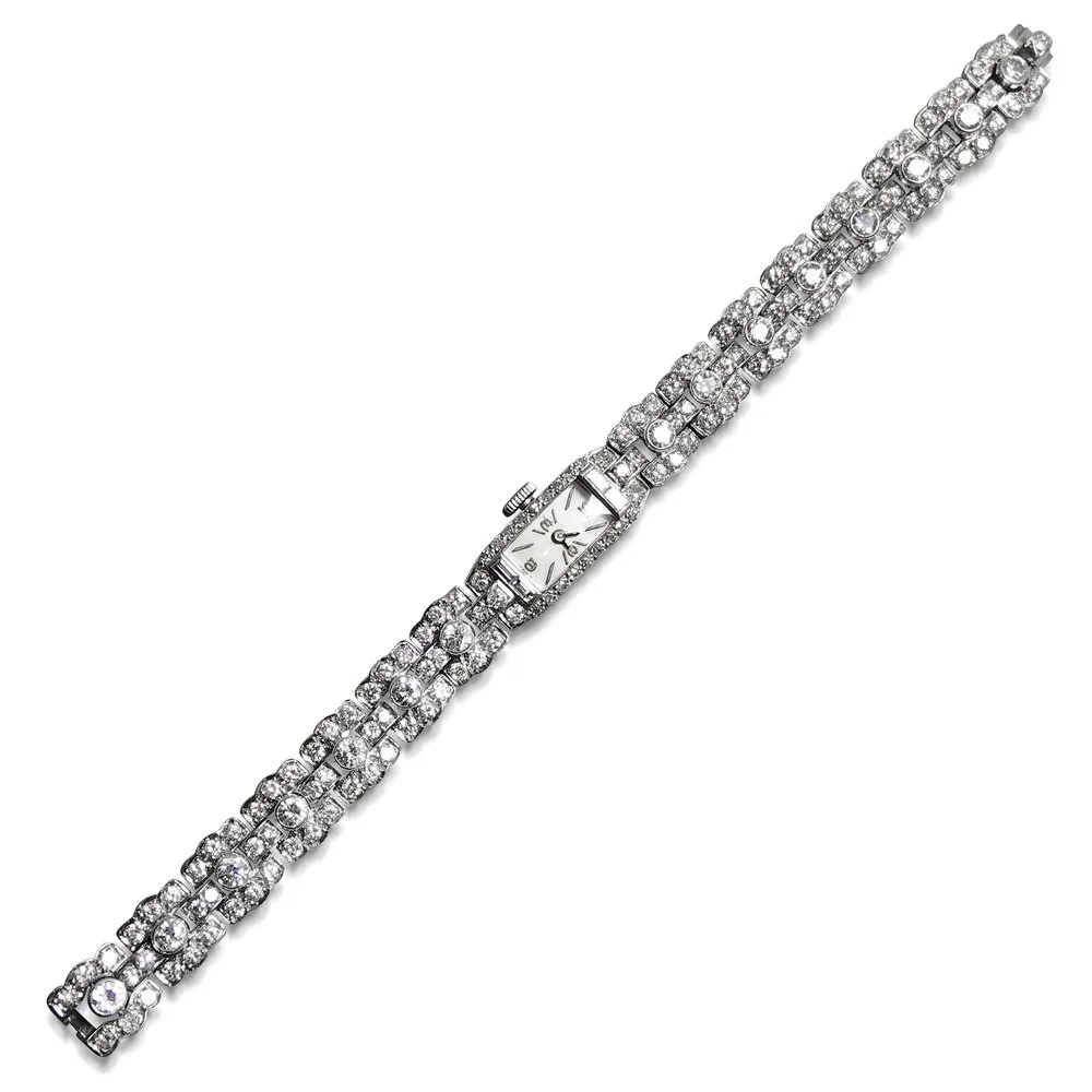A Platinum and Diamond watch, by Ruser, with Guelin movement, Swiss