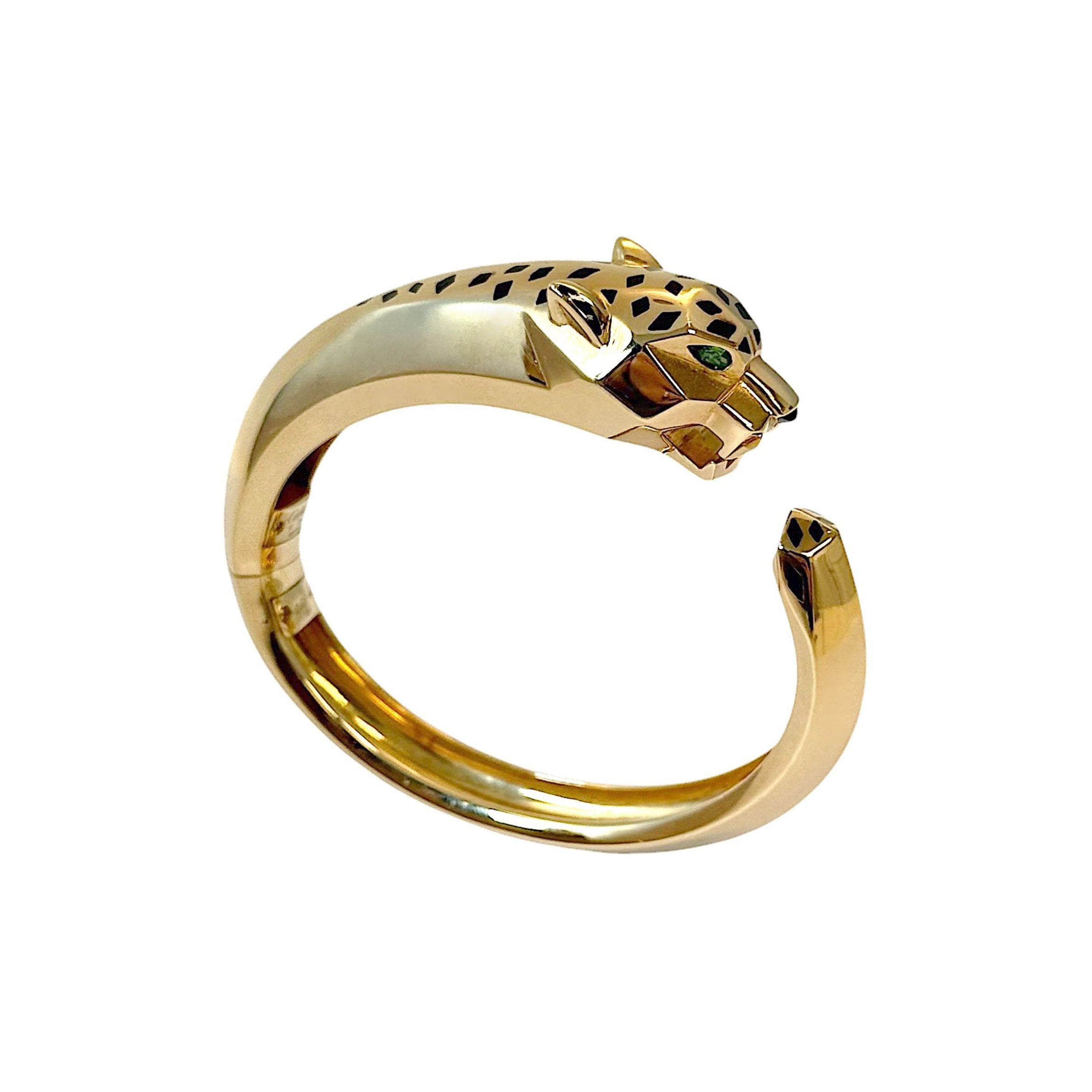 A Yellow Gold and Peridot 'Panthere' Bangle, by Cartier