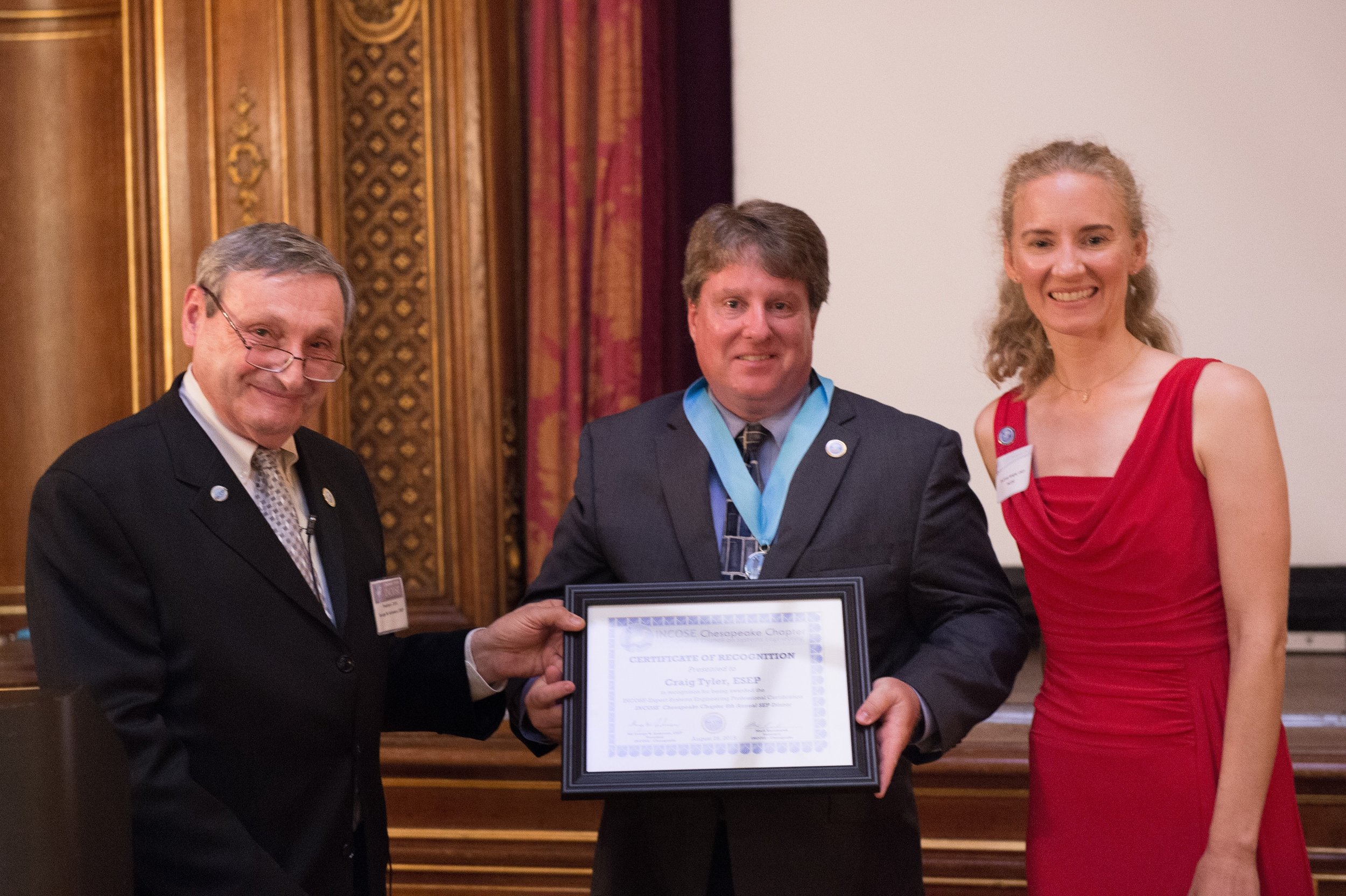 Craig Tyler receives his ESEP Recognition Certificate from George Anderson and Courtney Wright