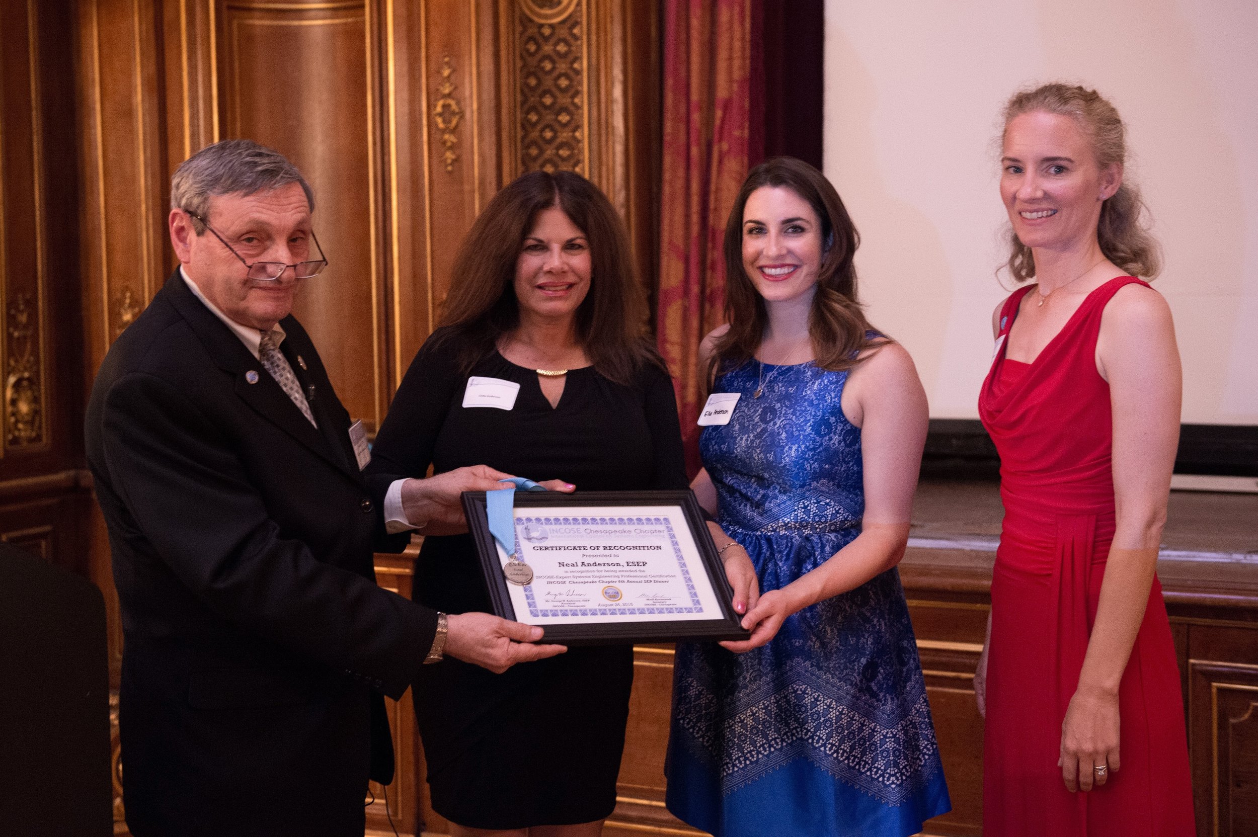 Neal Anderson’s ESEP Recognition Certificate is received by his wife and daughter (Neil was unavailable due to company business). Presented by George Anderson and Courtney Wright