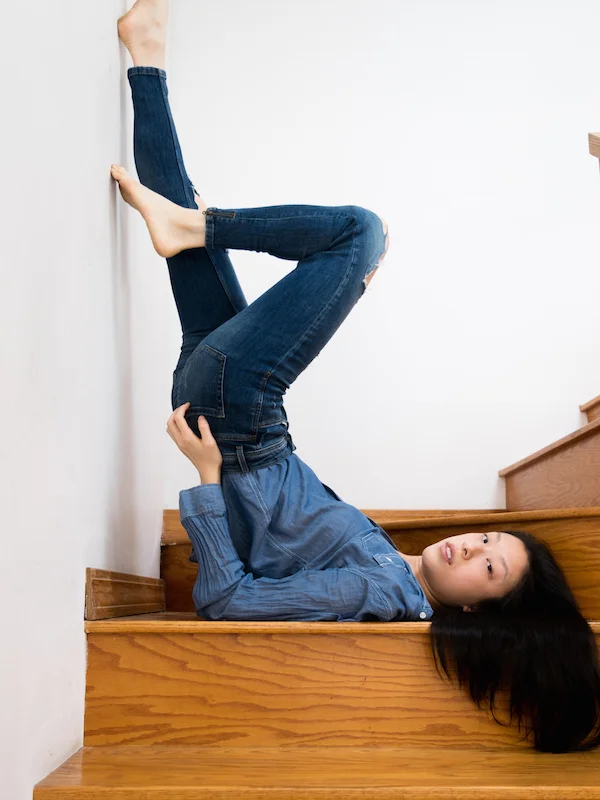 Female East asian style blogger wearing all blue denim outfit in shoulder stand