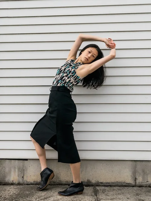 Gi Shieh Wearing Blue Leopard Print and Black Skirt