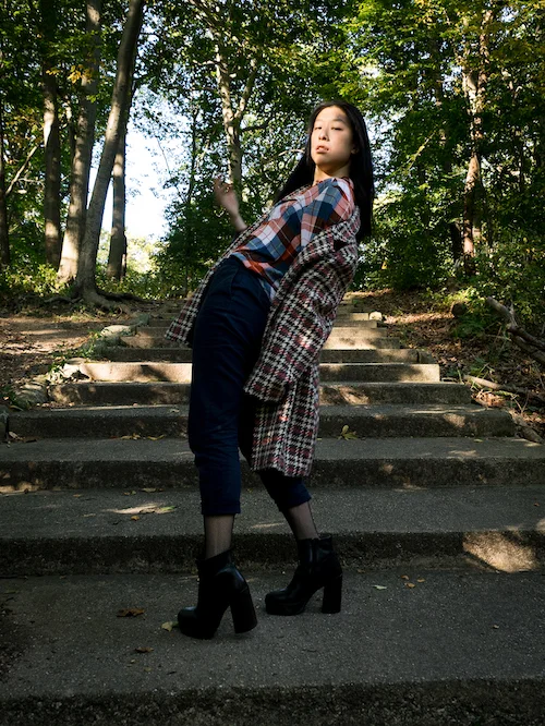 Plaid on plaid outfit with fishnet tights