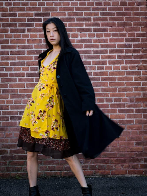 Yellow floral wrap dress, brown polka dot skirt, black trench