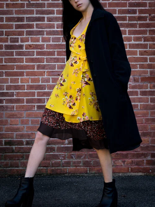 Yellow floral wrap dress, brown polka dot skirt, black trench Details