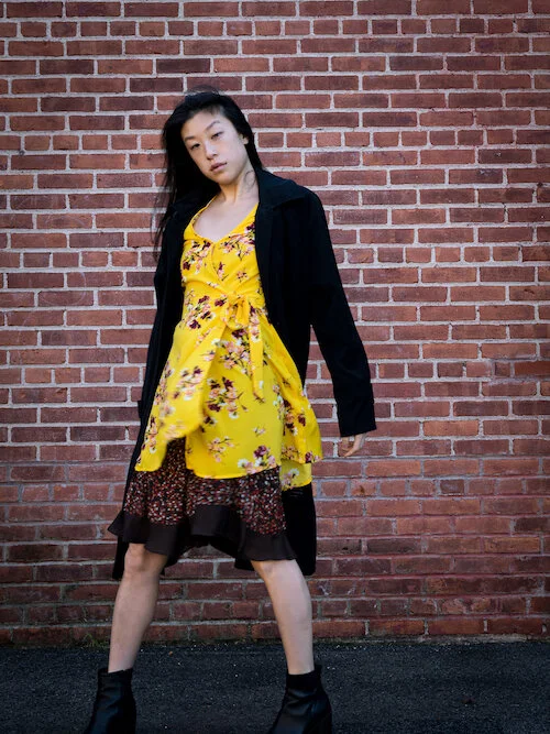 Yellow floral wrap dress, brown polka dot skirt, black trench