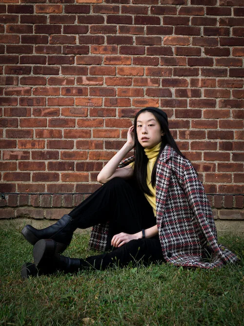 plaid overcoat, yellow turtleneck tee, black harem pants, black platform boots