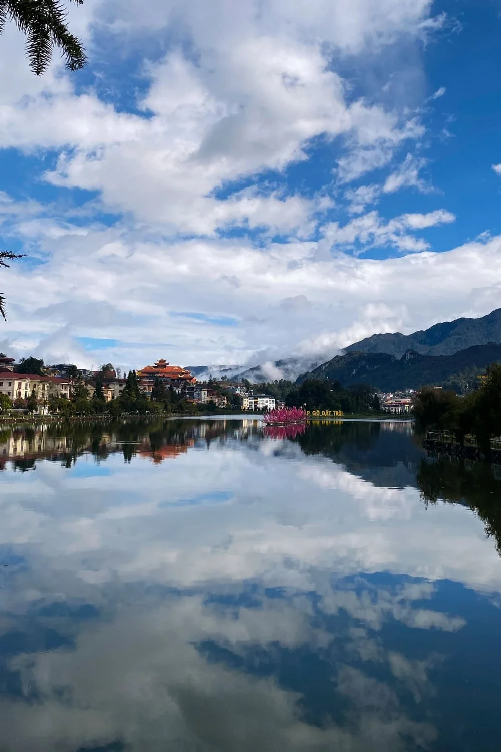 Sapa town reflected across the lake.