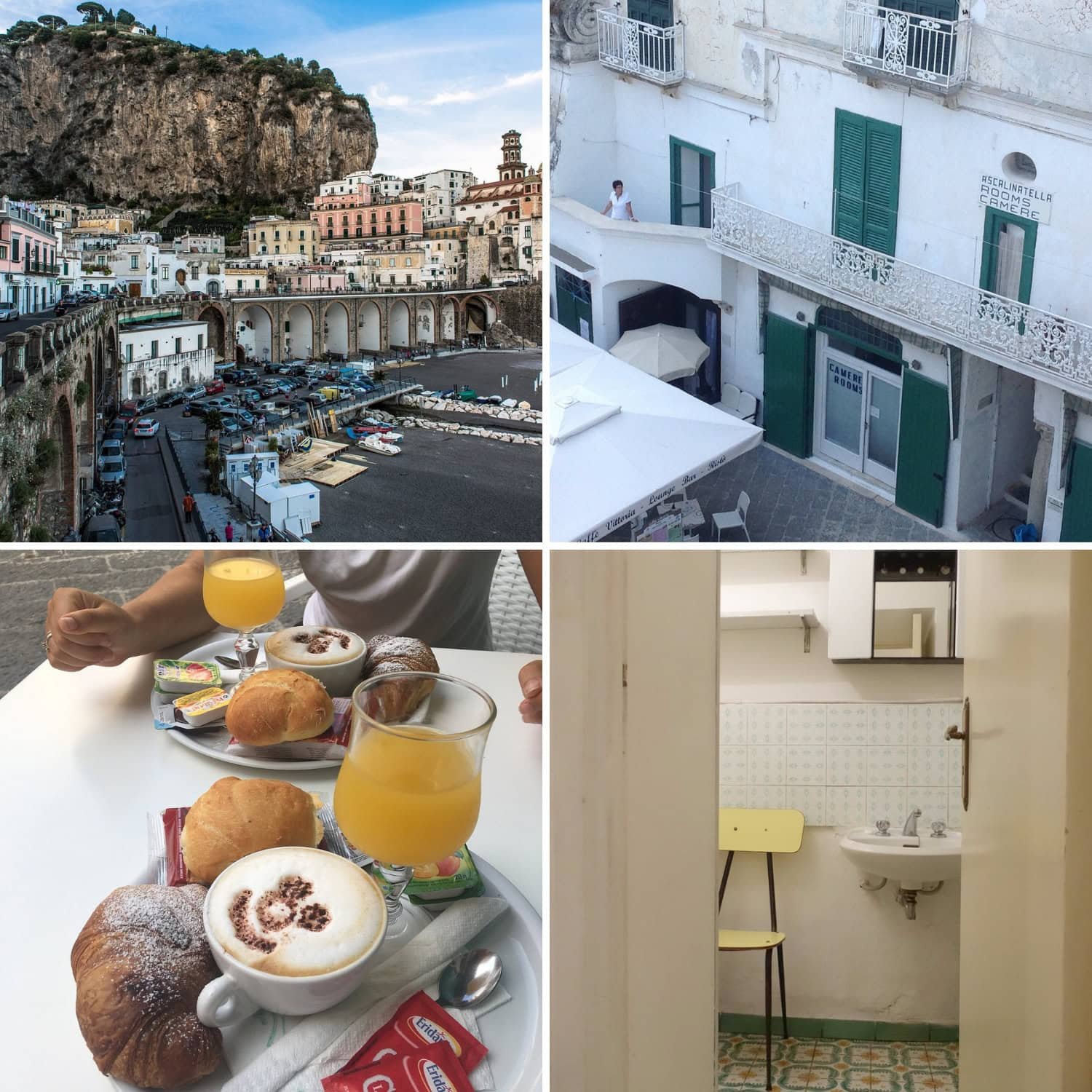 Coastal town with pastel buildings and arched structures built into the cliffs beside a small harbor. The scene highlights the picturesque architecture typical of places to stay in Amalfi.