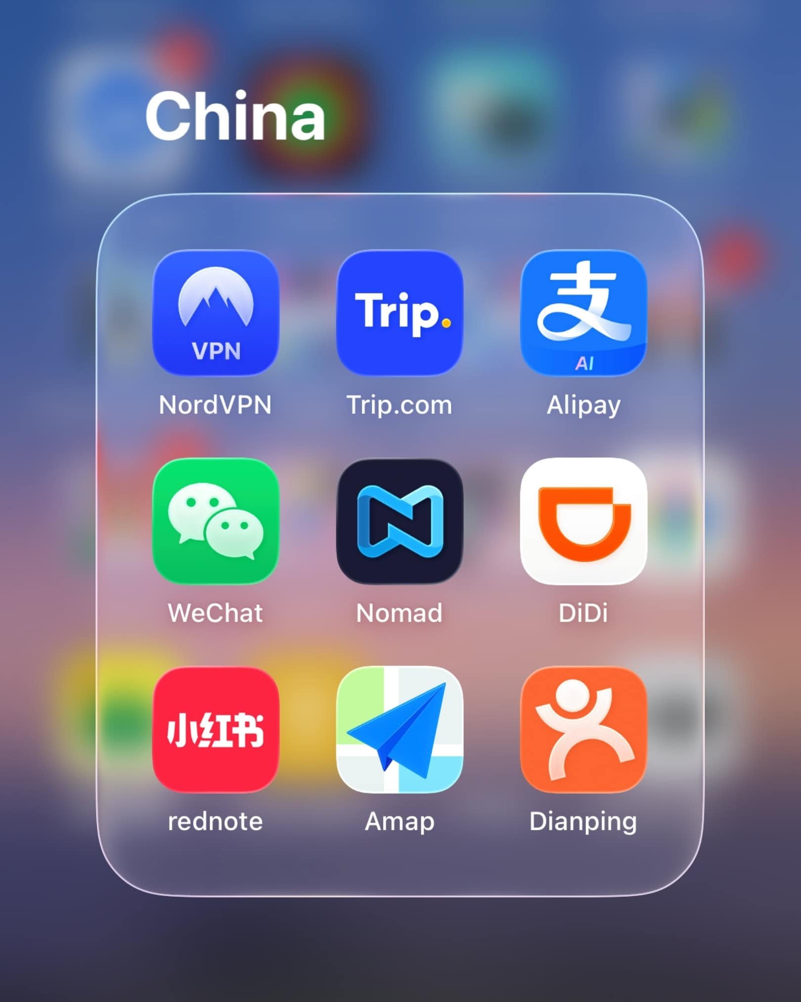 Smartphone folder displaying useful apps in China, including NordVPN, Trip.com, Alipay, WeChat, Nomad, DiDi, RedNote, Amap, and Dianping.
