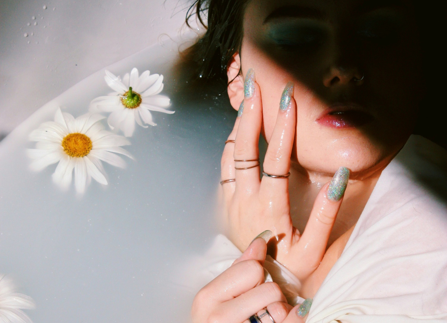 Woman showing her coral green nail art