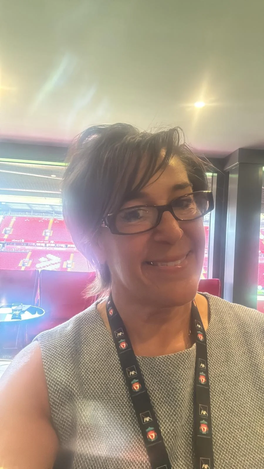 Infinity symbol inside a circle with a black background.