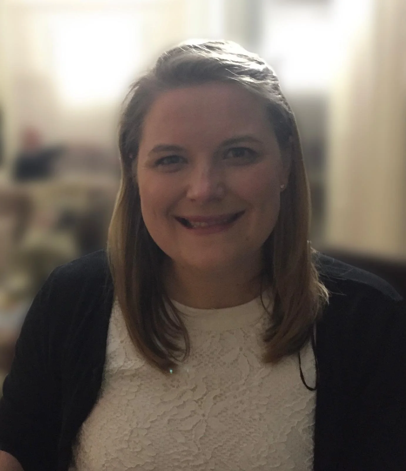 Black background with a white infinity symbol inside a white circle.