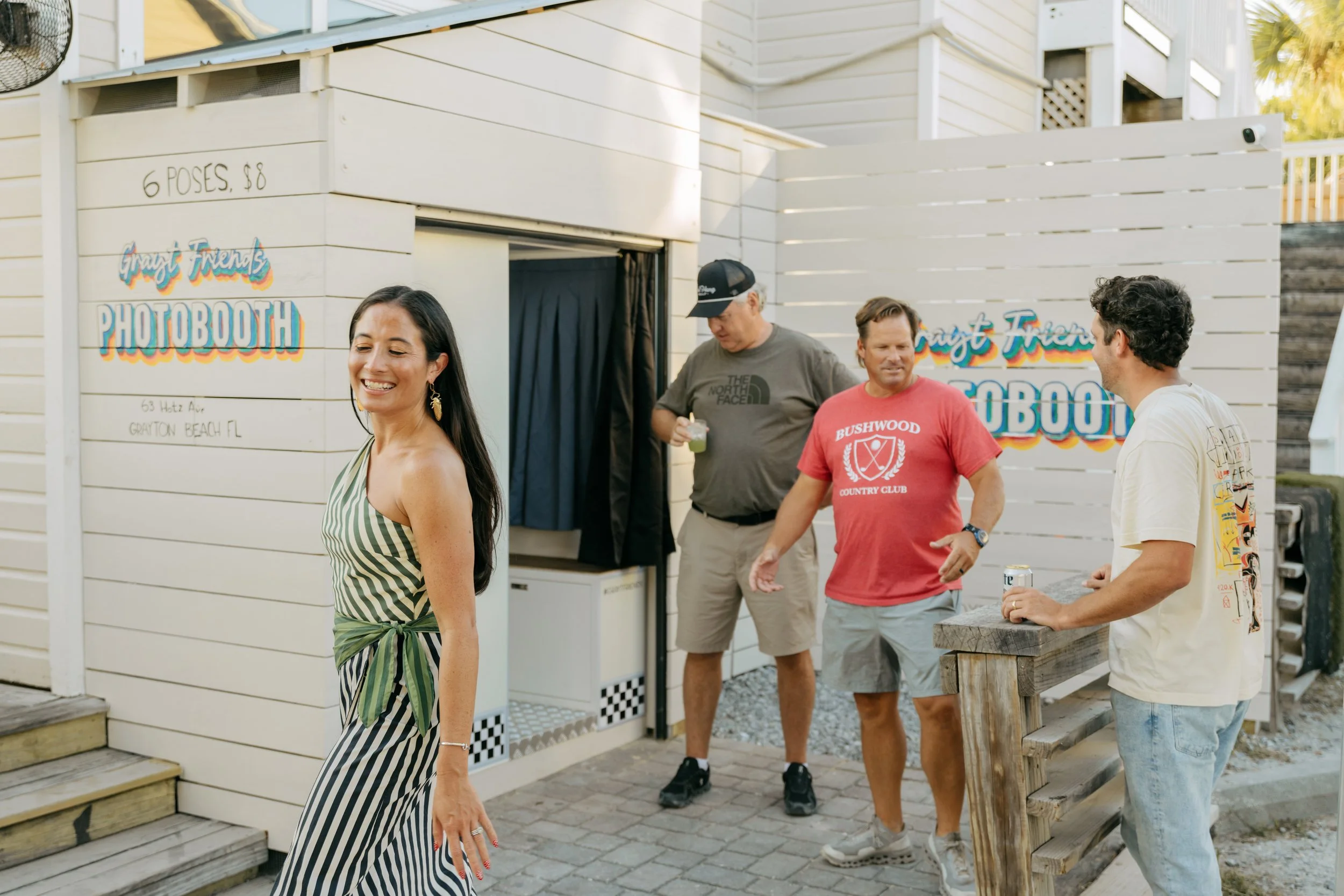 People standing around a PhotoWorks custom photo booth