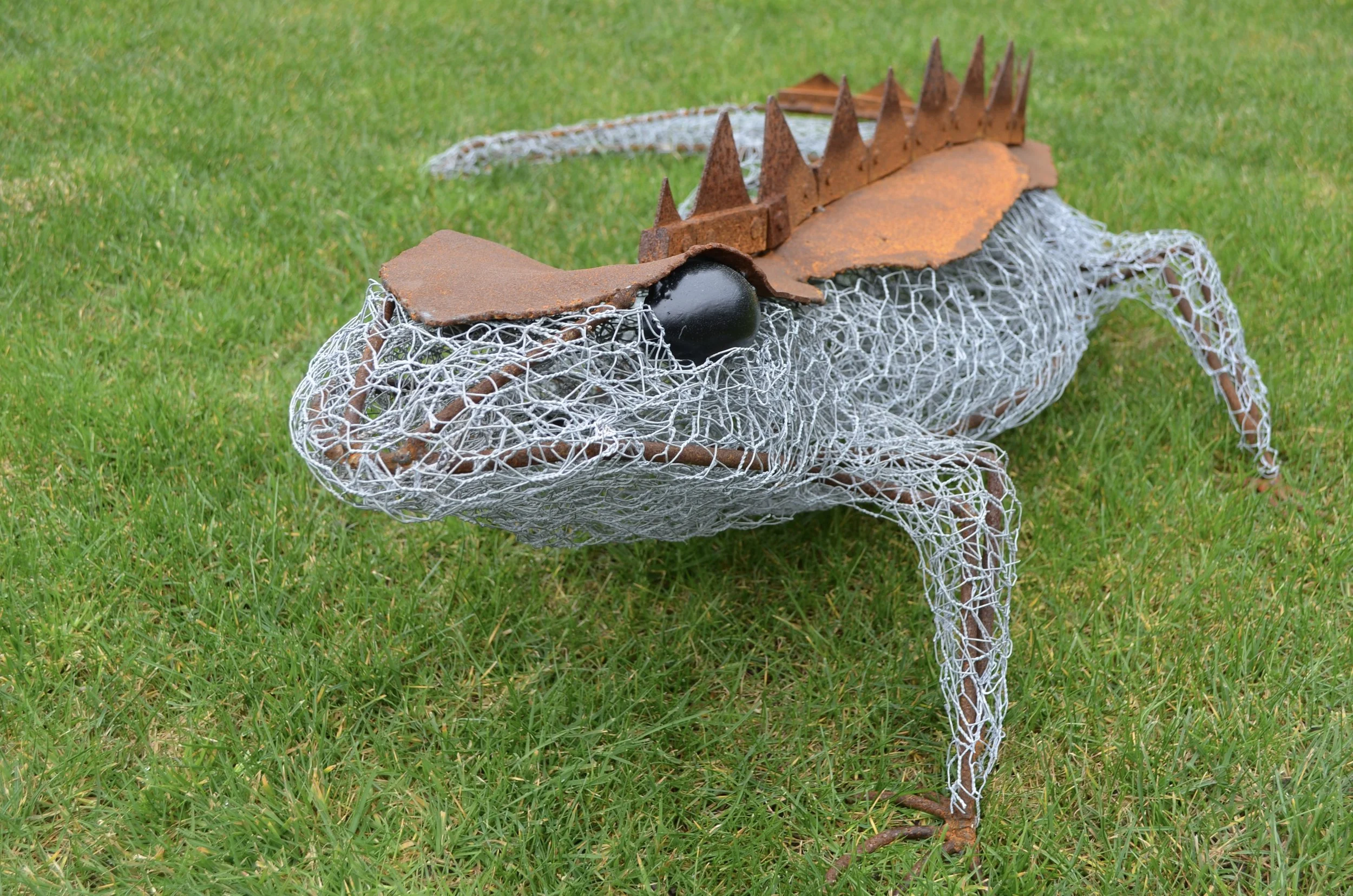 Rex the galvanised mesh and corten steel tuatara with saw blade spikes