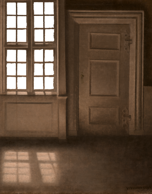 Old wooden door with a window on the left side and sunlight casting shadows on the floor.