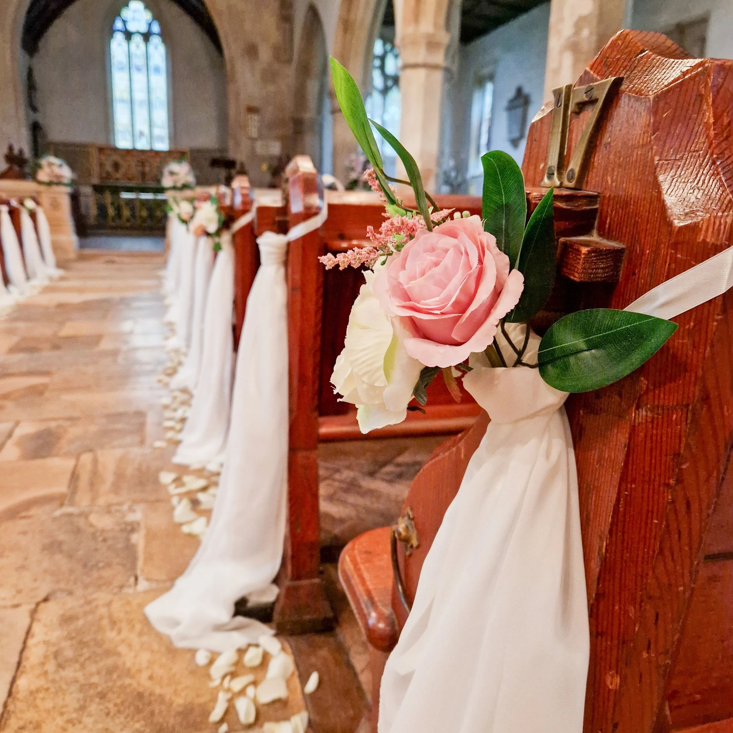Silk Floral Church Pew ends at St Batholomews Church, Gloucestershire