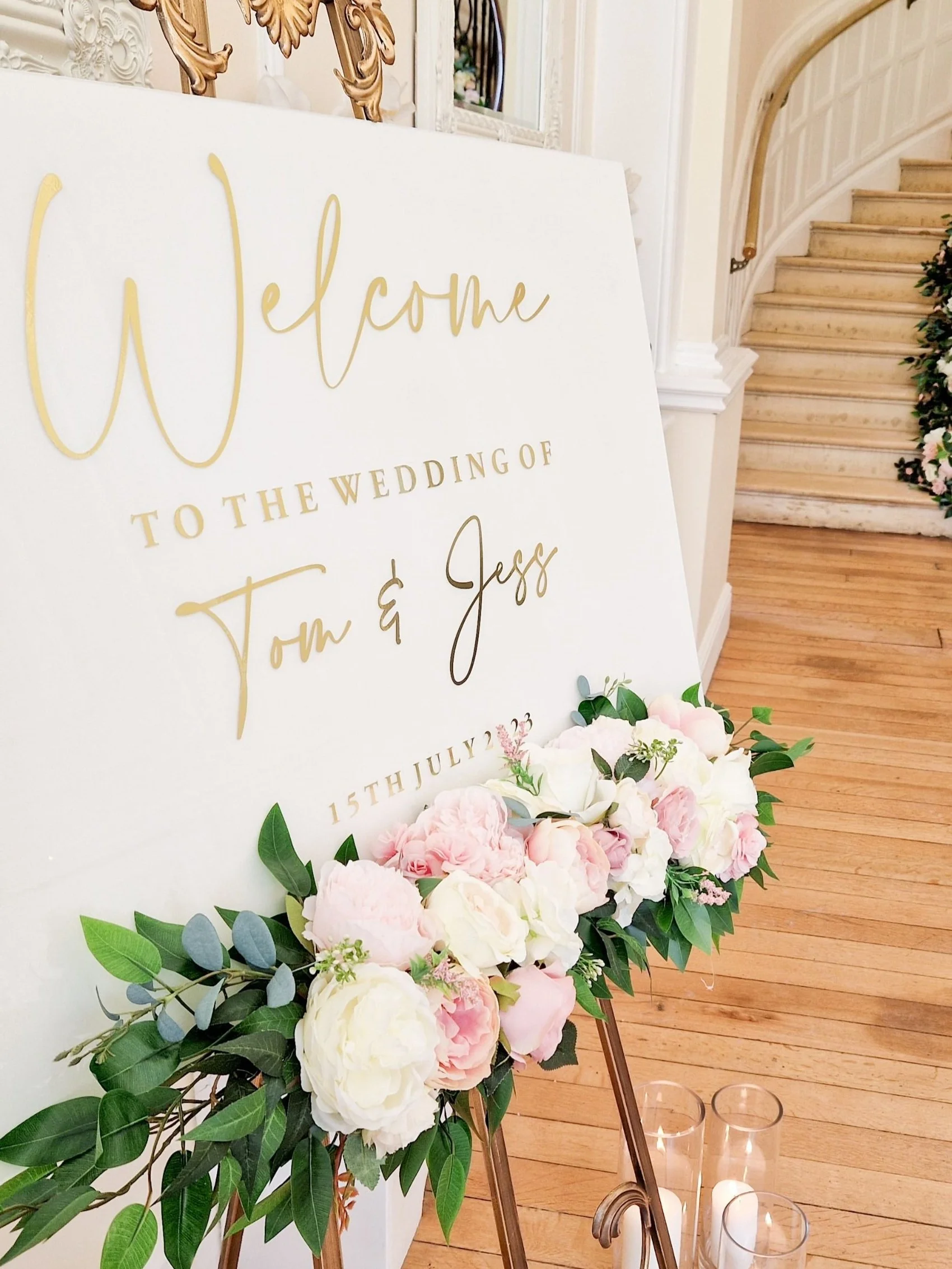 White Welcome signage with Gold lettering at Eastington Park designed and created by All Things Pretty Weddings