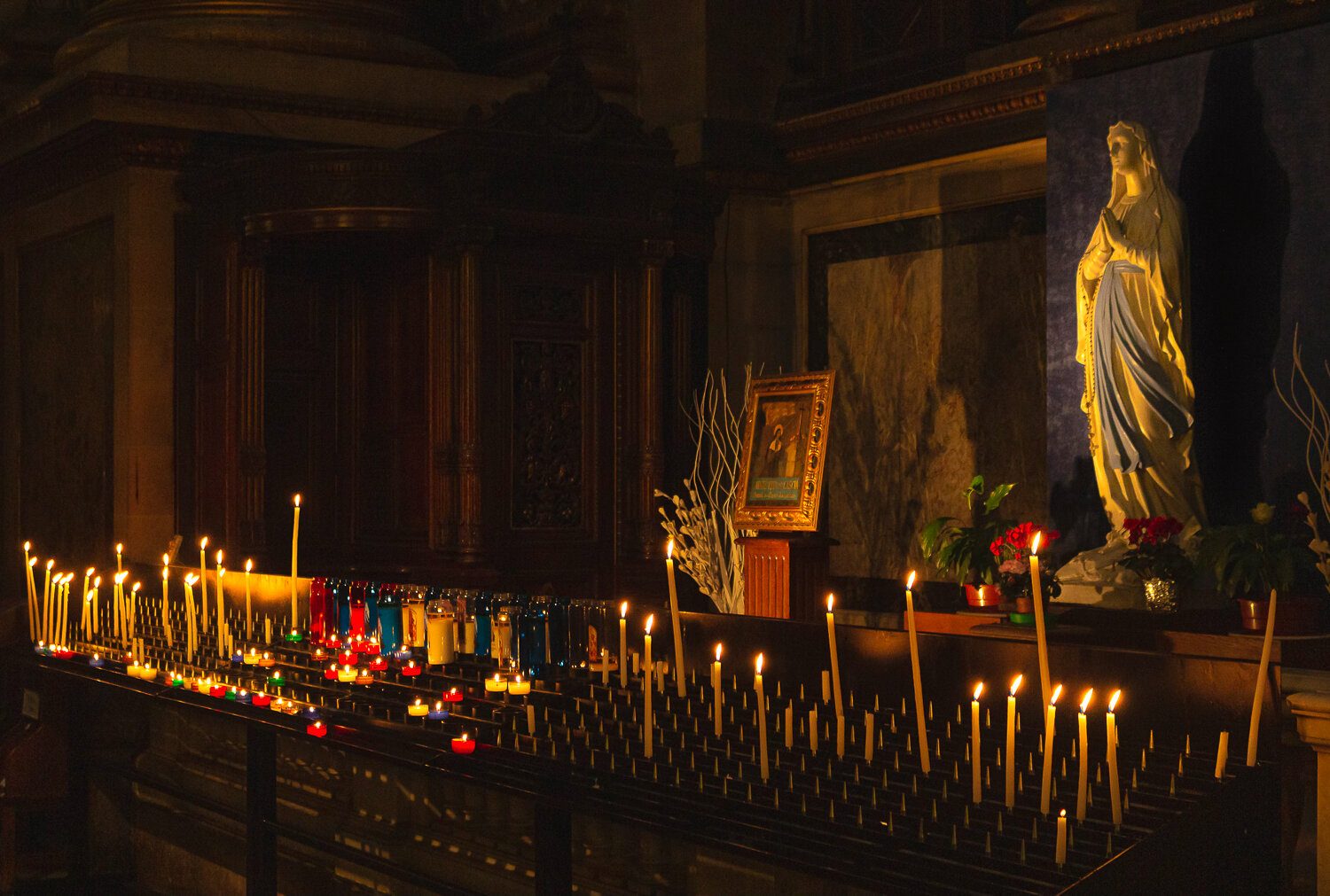 Candles inside la Madeleine in Paris